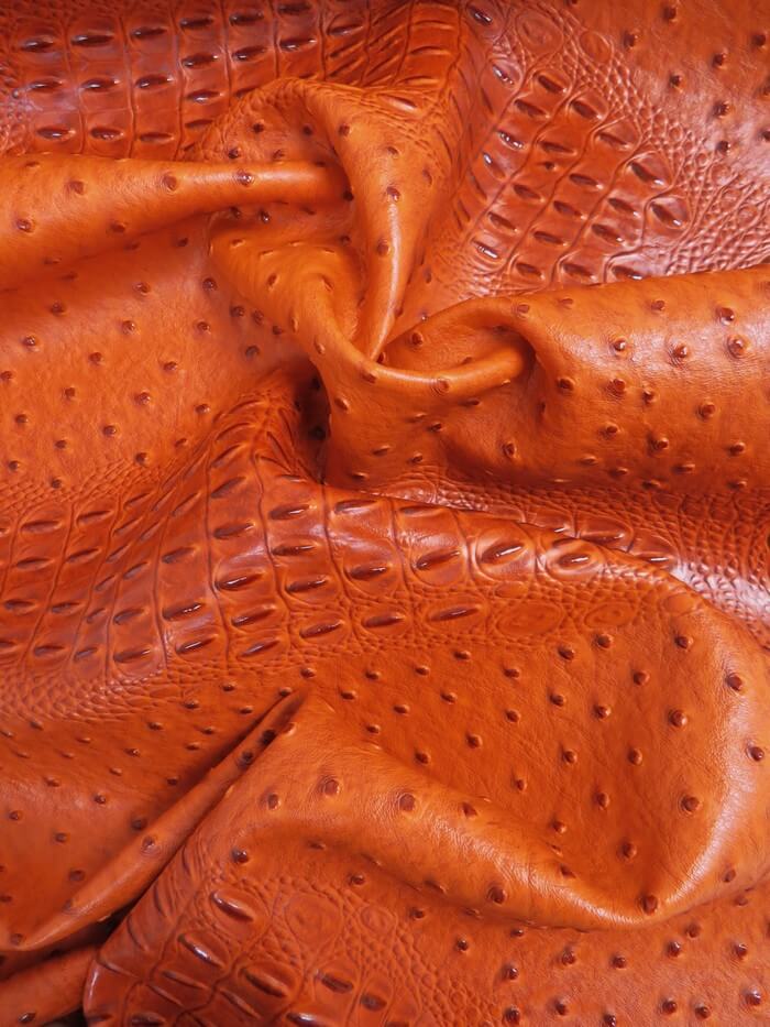 Poison Orange Mutant Ostrich Gator Embossed Vinyl Fabric / Sold By The Yard