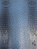 Raging Blue Mutant Ostrich Gator Embossed Vinyl Fabric / Sold By The Yard
