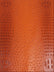 Poison Orange Mutant Ostrich Gator Embossed Vinyl Fabric / Sold By The Yard